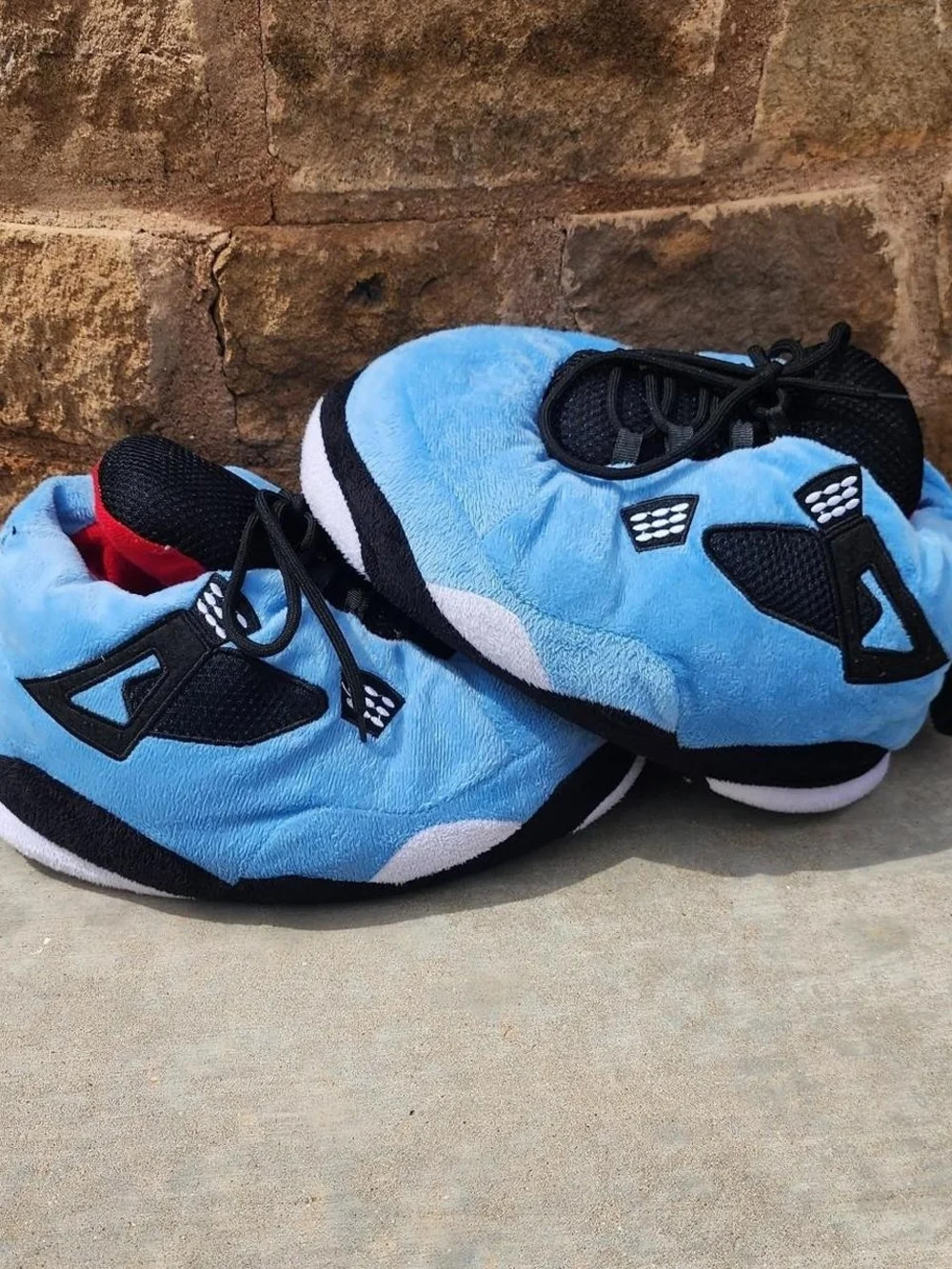 Air Jordan 4s Kids Light Blue Plush Lace-Up Sneakers with Black Accents